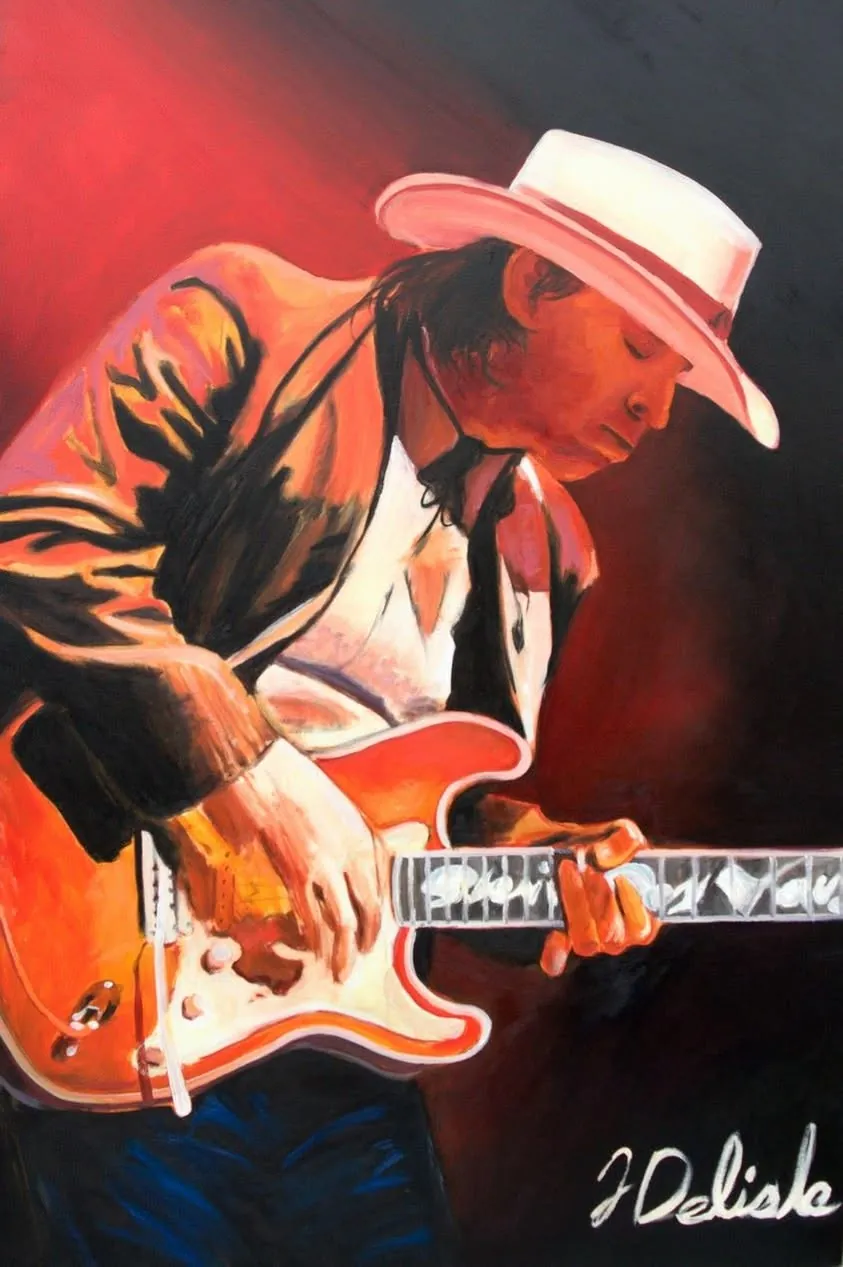 Toile d'un guitariste au chapeau de cowboy, guitare rouge, sur fond rouge et noir